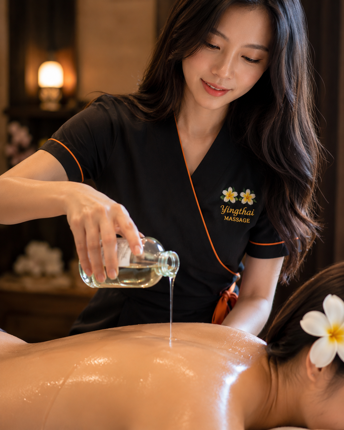 Therapist pouring aromatic massage oil for Thai oil massage